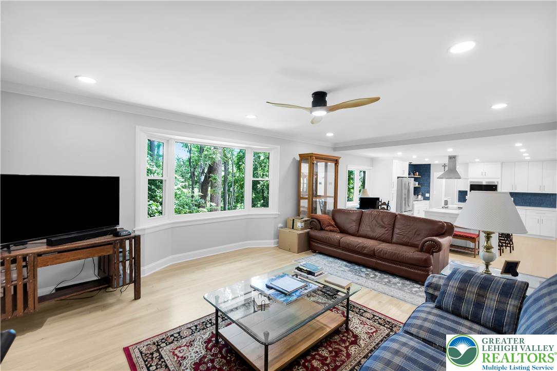 2011 Greenwood Road Allentown, PA 18103 - Photo 22 of 52 A spacious, luminous living area with hardwood flooring and recessed lighting offers verdant outdoor views.