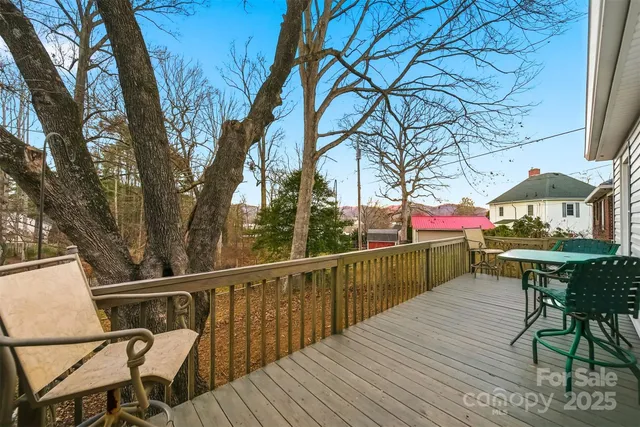 a view of a chairs and table on the deck