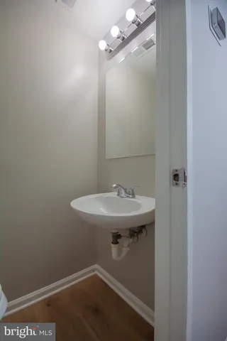 a bathroom with a sink and mirror