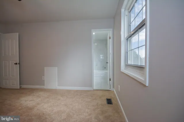 a bathroom with a bathtub and a toilet