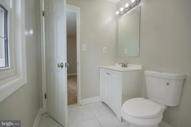 a bathroom with a bathtub and a toilet