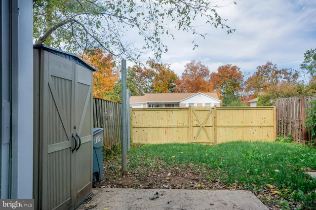 a view of a backyard of the house