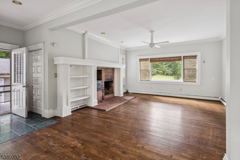 17 Three Gables Road Morristown, NJ 07960 - Photo 12 of 43 a view of empty room with wooden floor and fireplace