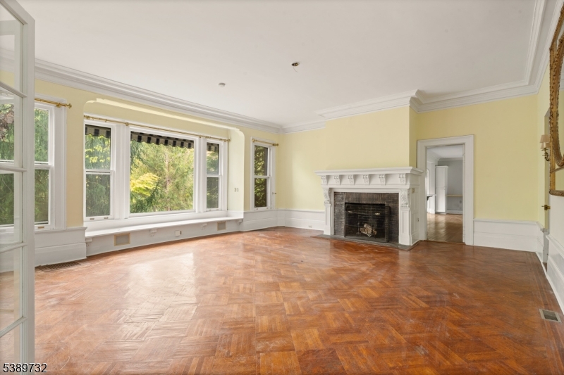 17 Three Gables Road Morristown, NJ 07960 - Photo 18 of 43 a view of an empty room with a fireplace and a window
