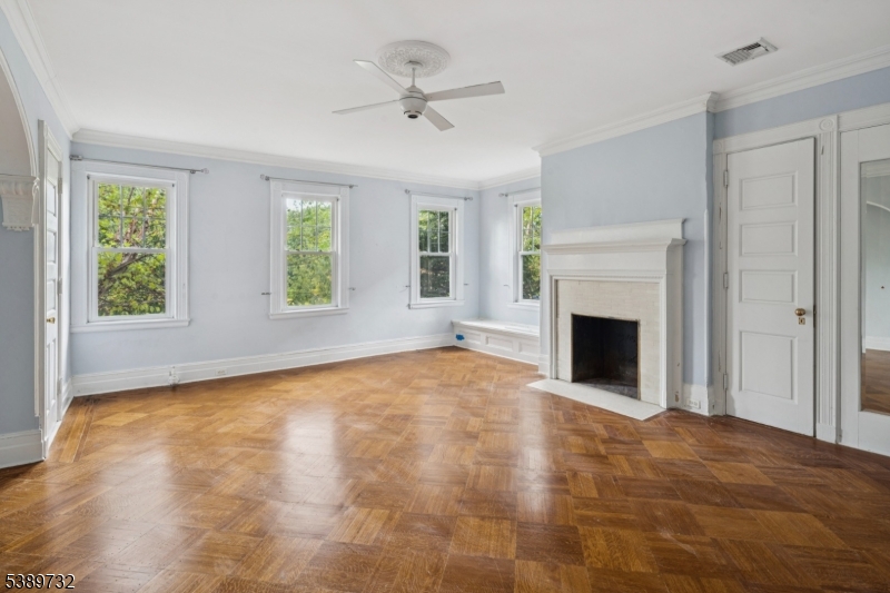 17 Three Gables Road Morristown, NJ 07960 - Photo 27 of 43 a view of empty room with fireplace and windows