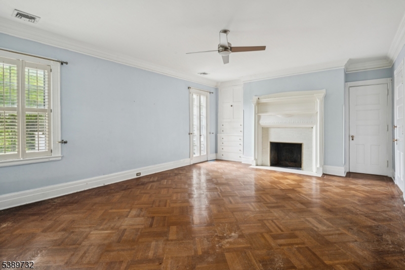 17 Three Gables Road Morristown, NJ 07960 - Photo 29 of 43 a view of an empty room with a fireplace and a window