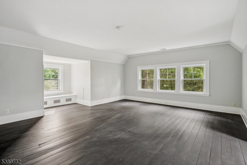 17 Three Gables Road Morristown, NJ 07960 - Photo 33 of 43 an empty room with wooden floor and windows