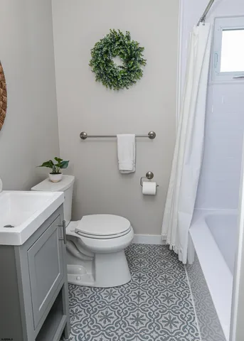 a bathroom with a toilet a sink and a bathtub