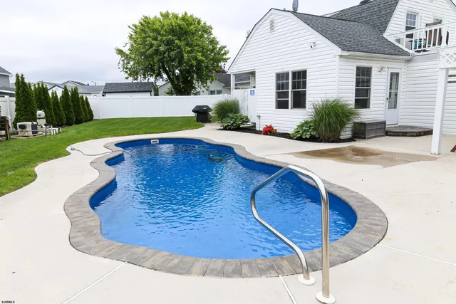a view of a backyard with plants