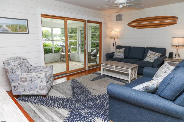 a living room with furniture and a rug