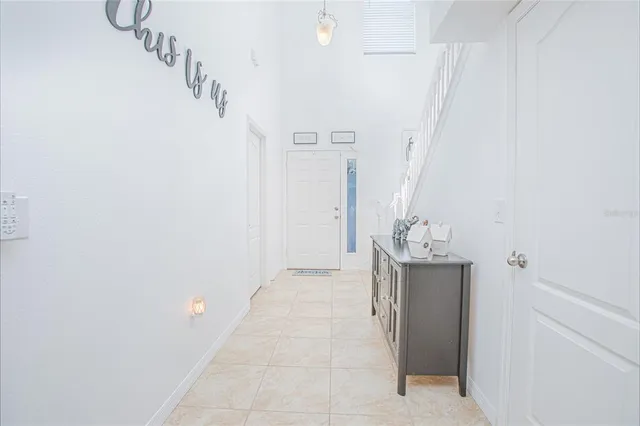 a kitchen with stainless steel appliances kitchen island granite countertop a table and chairs in it