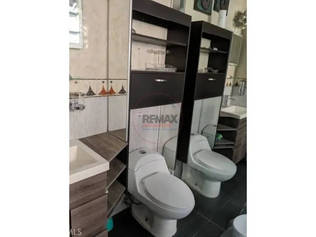 a bedroom with a bed and cabinets