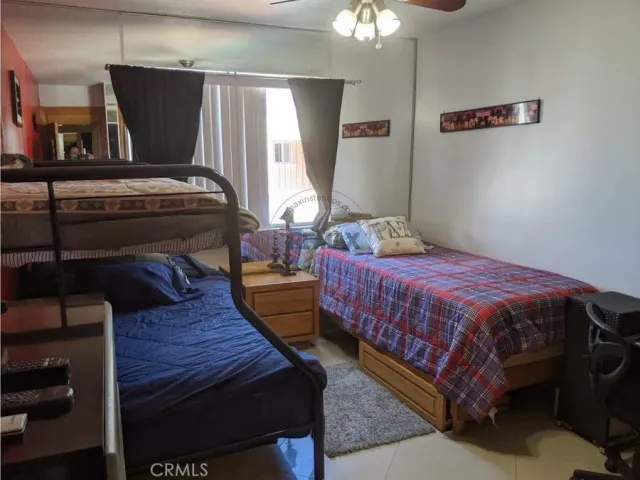 a roof deck with table and chairs couches with wooden floor