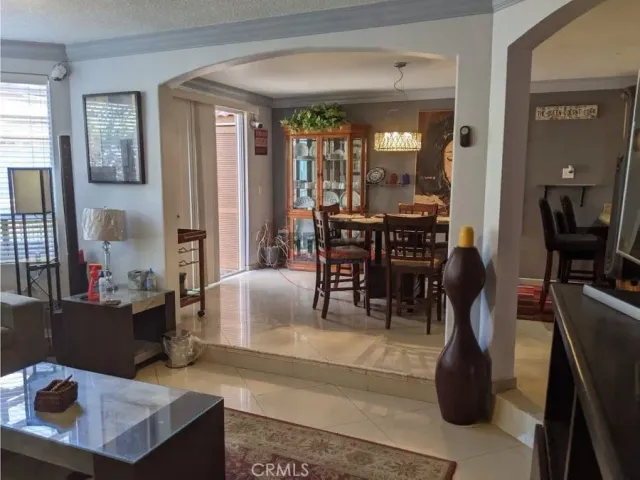 a view of a dining room with furniture and window