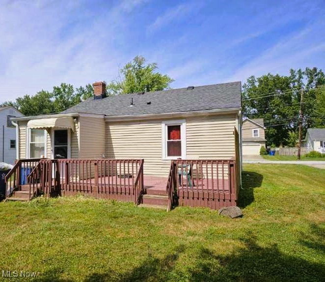 View of back of 38754 Adkins with large deck over looking beautiful deep lot