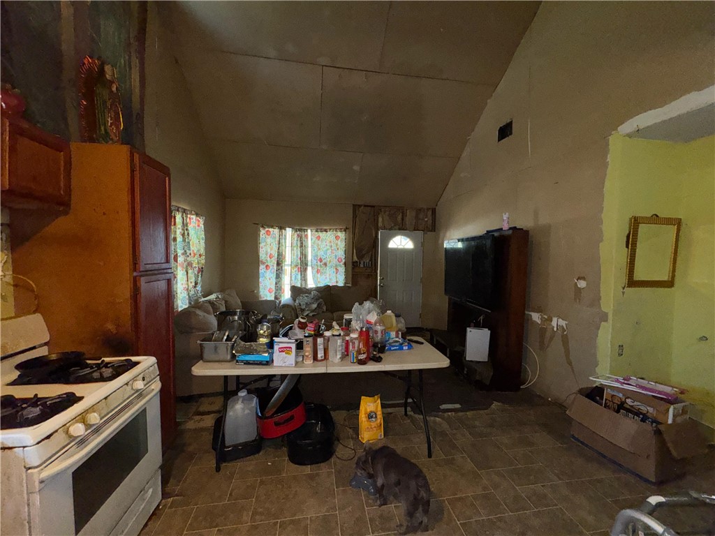 122 West 5th Street Alice, TX 78332 - Photo 14 of 40 a living room with furniture and a flat screen tv