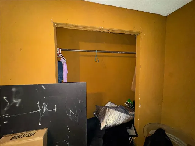 a bedroom with a bed and furniture