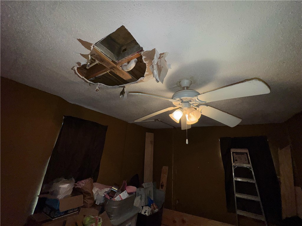 122 West 5th Street Alice, TX 78332 - Photo 28 of 40 a living room with furniture and gym equipment