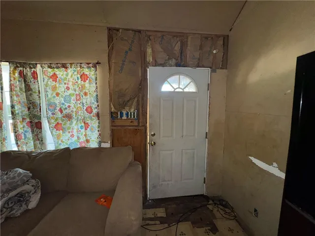 a view of entryway with stairs and furniture