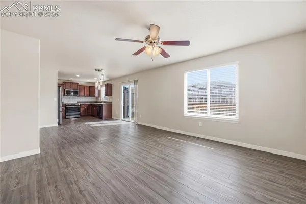 a kitchen with stainless steel appliances granite countertop a sink stove microwave and cabinets