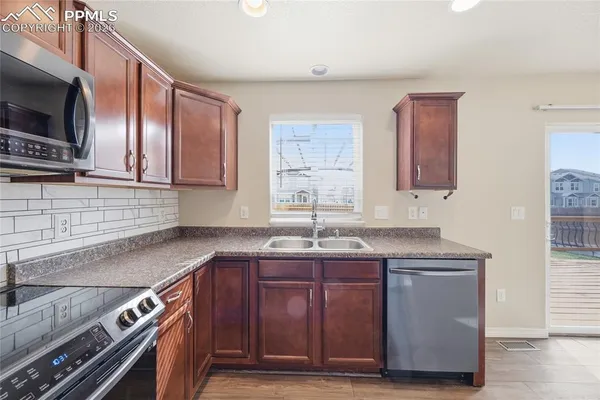 a kitchen with a stove and a microwave