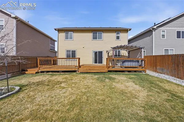 a house view with a backyard space