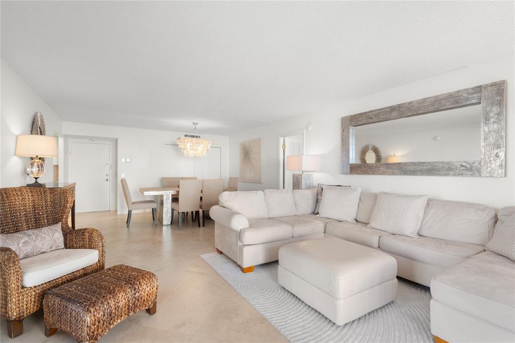 2000 South Ocean Boulevard, Unit 5D Lauderdale-by-the-Sea, FL 33062 - Photo 11 of 27 a living room with furniture and a couch