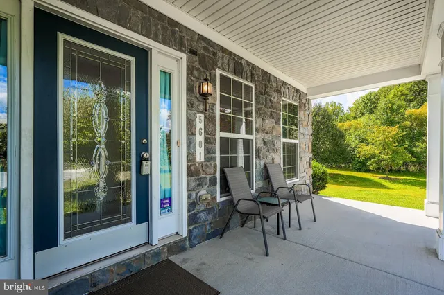 a view of swimming pool with a table and chairs