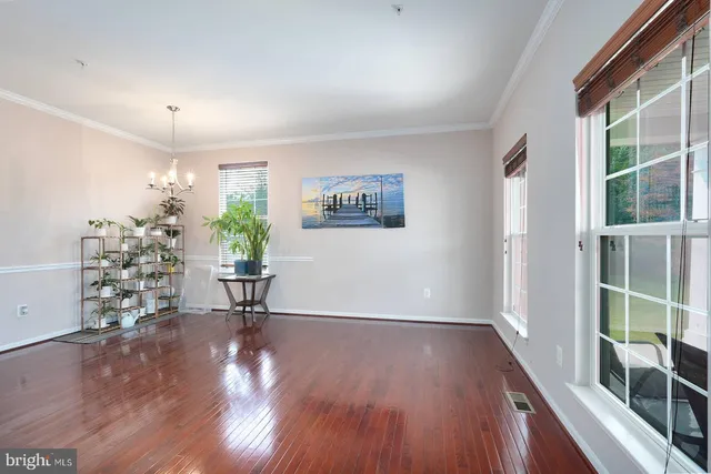 a view of livingroom with furniture window and wooden floor