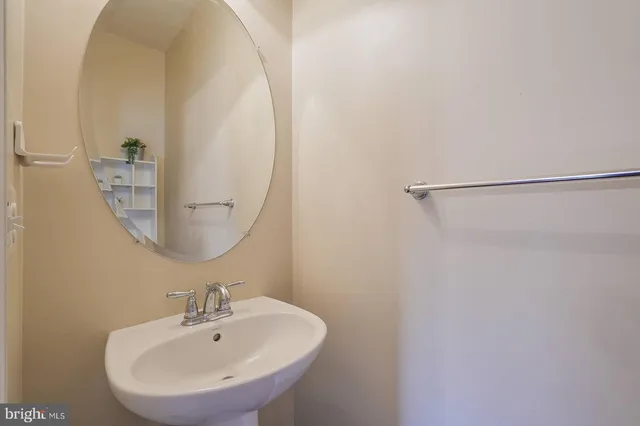 a bathroom with a sink and mirror
