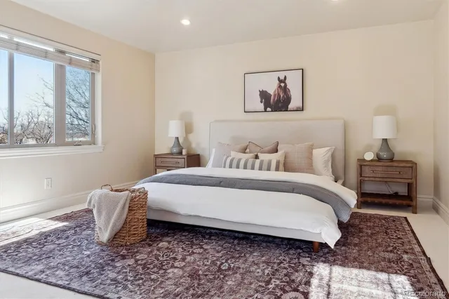 a bedroom with bed and a window