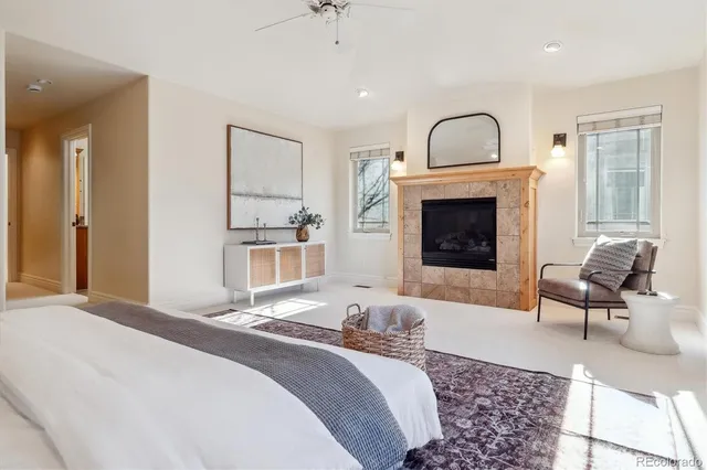 a bedroom with a bed and a fireplace