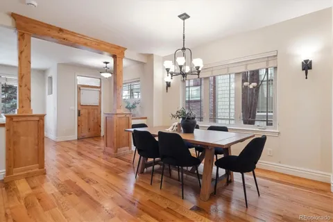 a view of a dining room with furniture window and wooden floor