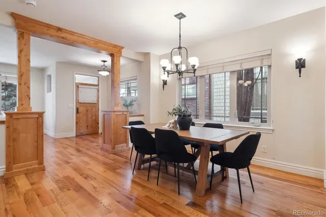 a view of a dining room with furniture window and wooden floor