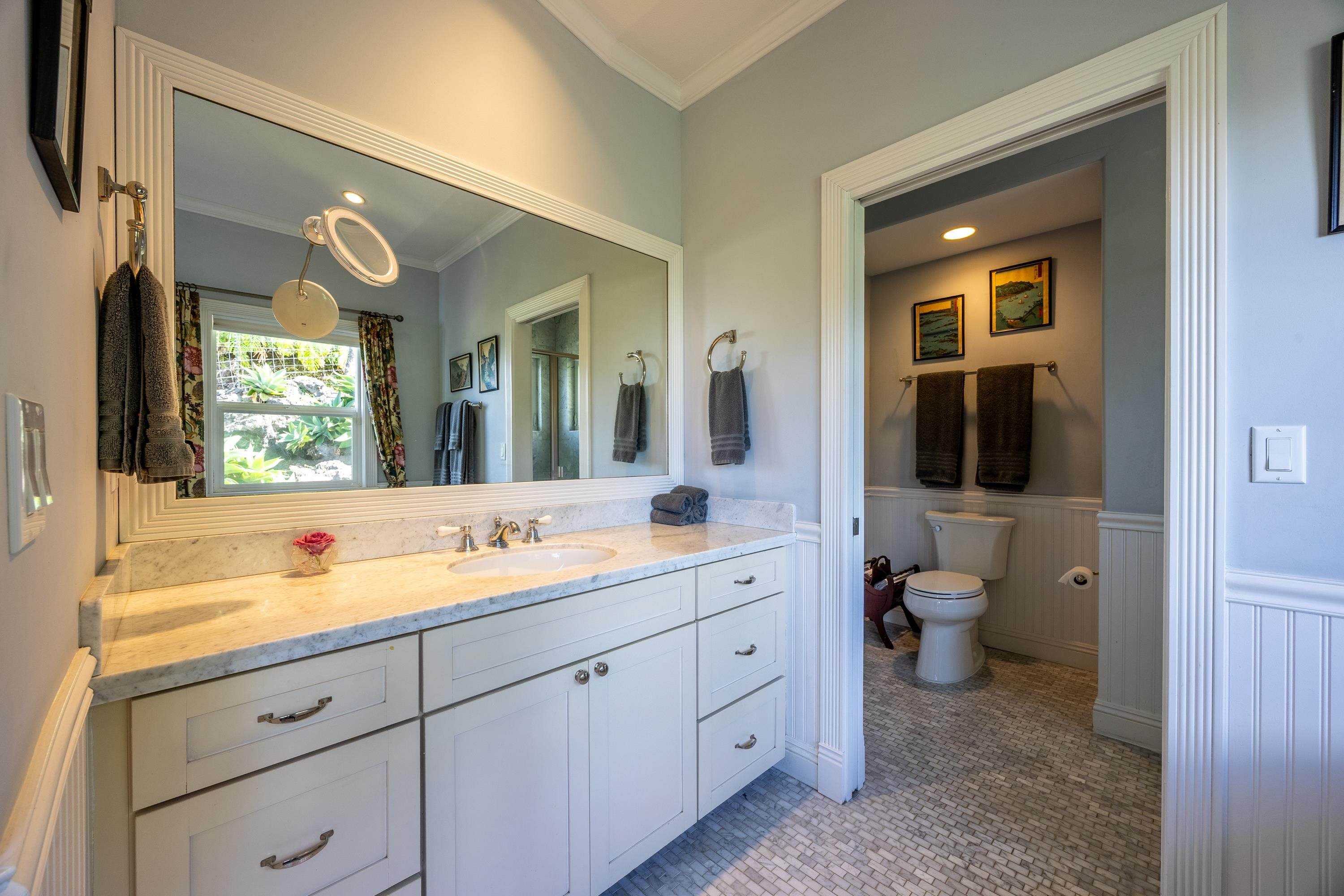 980 Polipoli Road Kula, HI 96790 - Photo 33 of 50 a spacious bathroom with a granite countertop sink mirror and bathtub