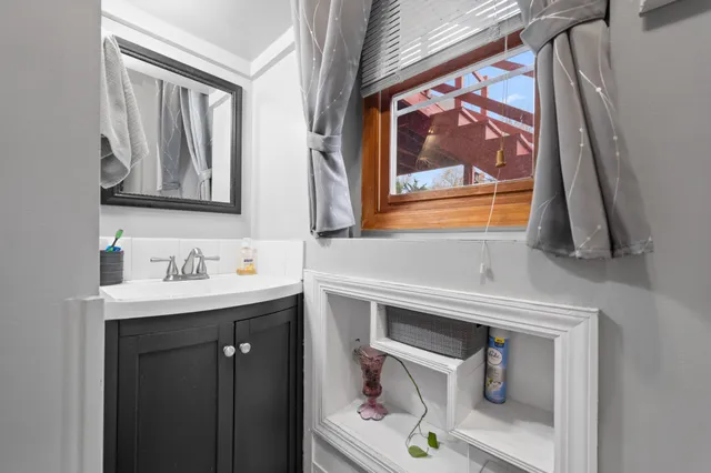 a bathroom with a sink and a mirror