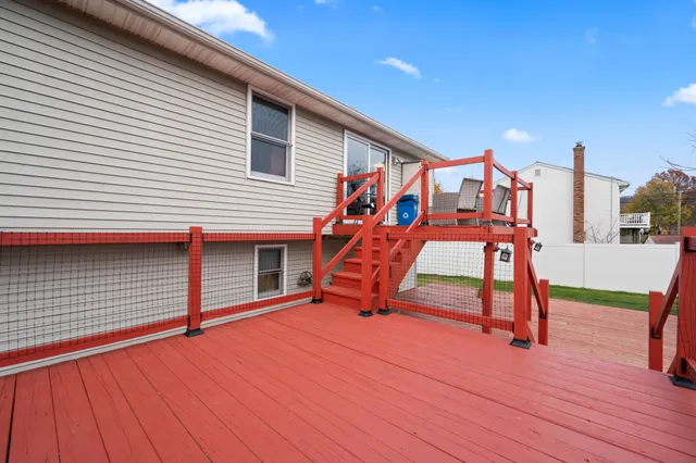 a front view of a house with a garden and yard