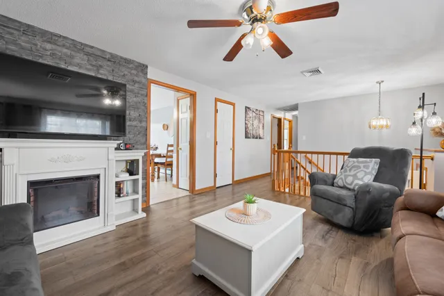 a living room with furniture and a fireplace