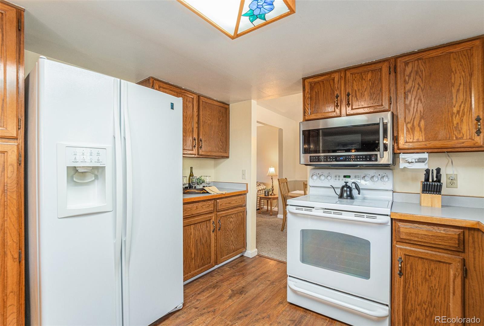 10110 Oak Street Westminster, CO 80021 - Photo 11 of 40 a kitchen with a refrigerator stove and sink