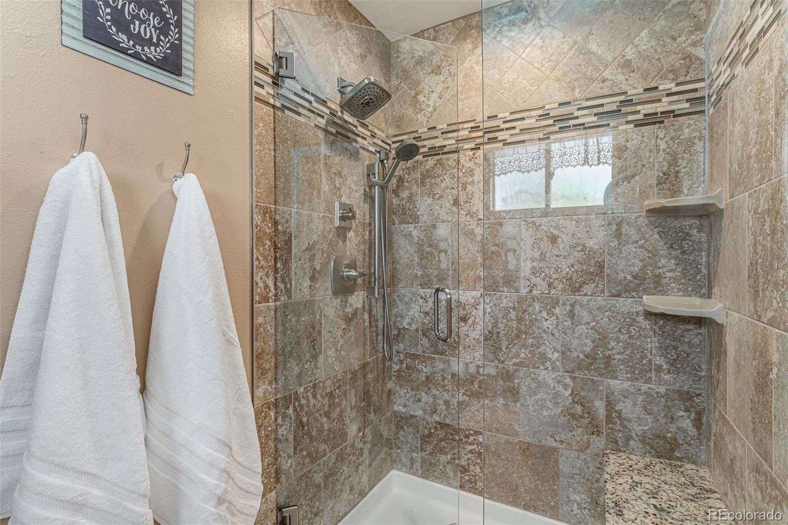 10110 Oak Street Westminster, CO 80021 - Photo 22 of 40 a bathroom with a shower