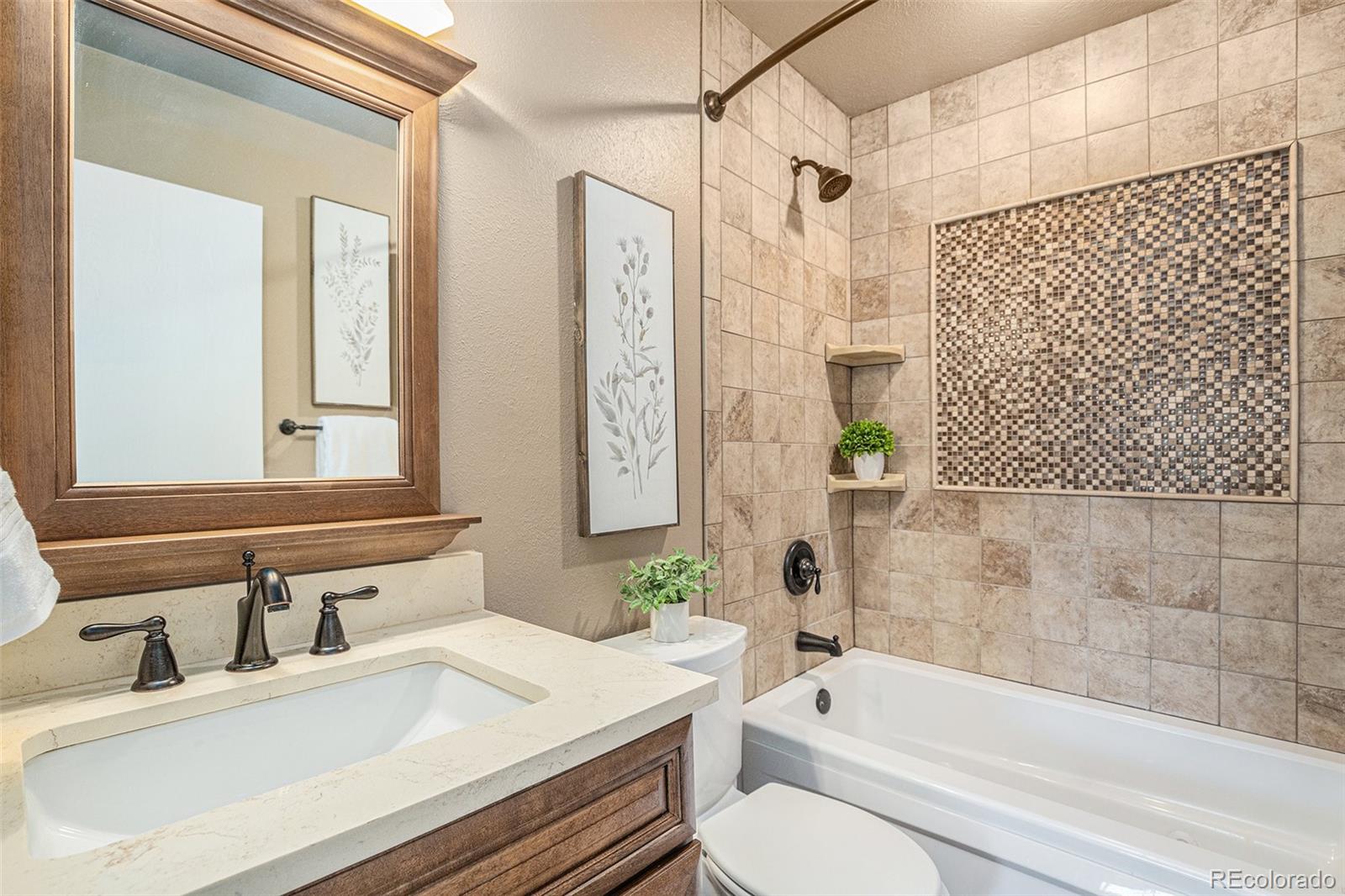 10110 Oak Street Westminster, CO 80021 - Photo 28 of 40 a bathroom with a sink and a mirror