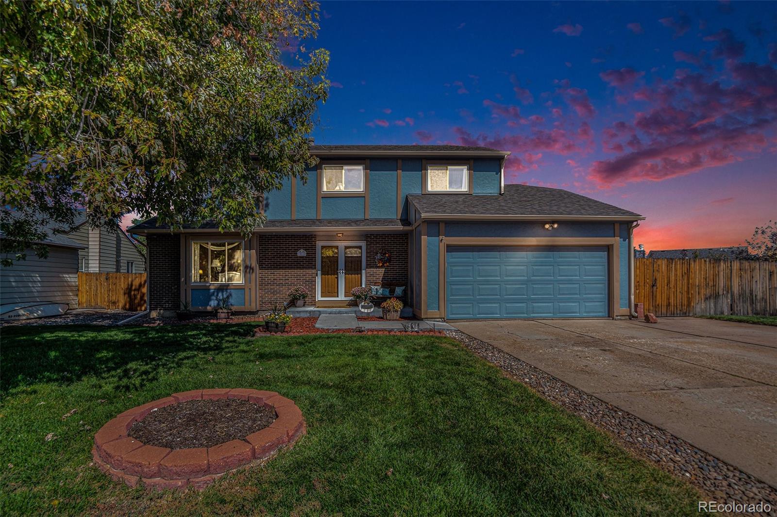 10110 Oak Street Westminster, CO 80021 - Photo 3 of 40 a view of a house with a backyard