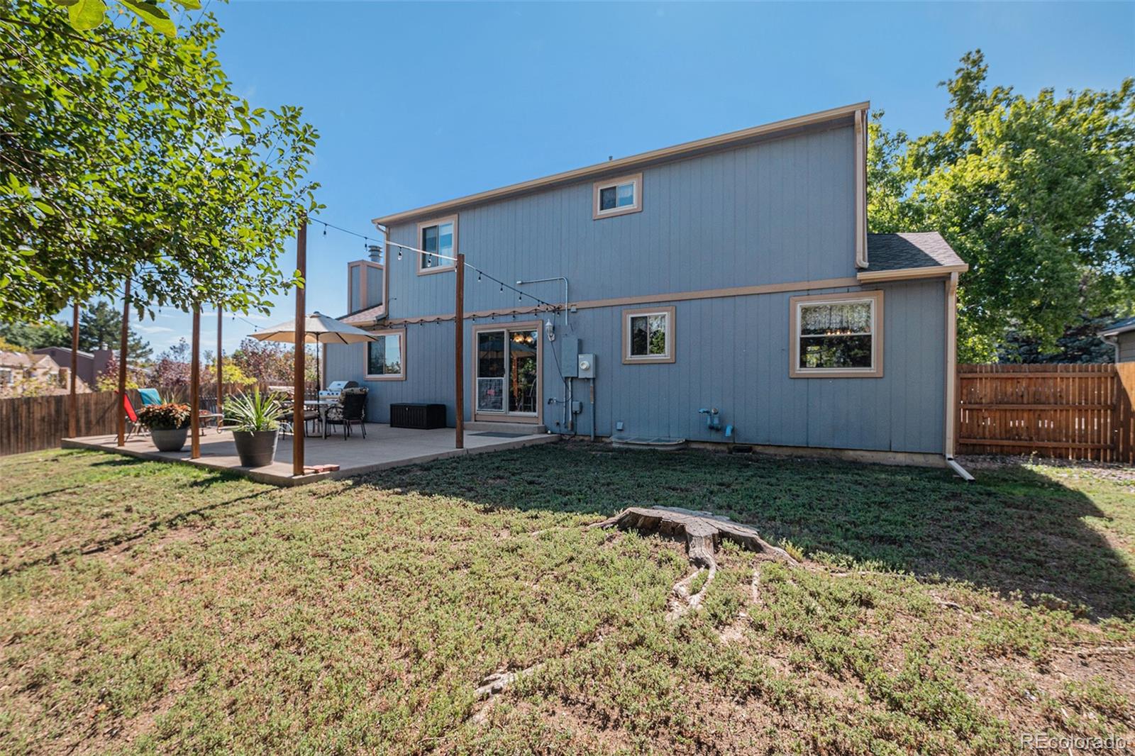 10110 Oak Street Westminster, CO 80021 - Photo 36 of 40 front view of a house with a yard