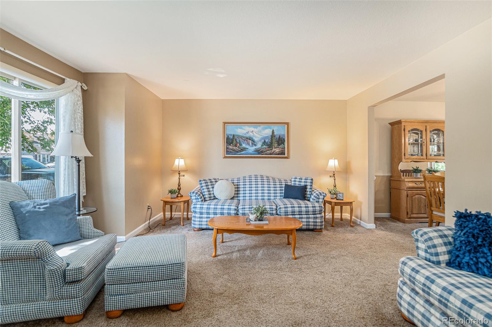 10110 Oak Street Westminster, CO 80021 - Photo 7 of 40 a living room with furniture and a lamp