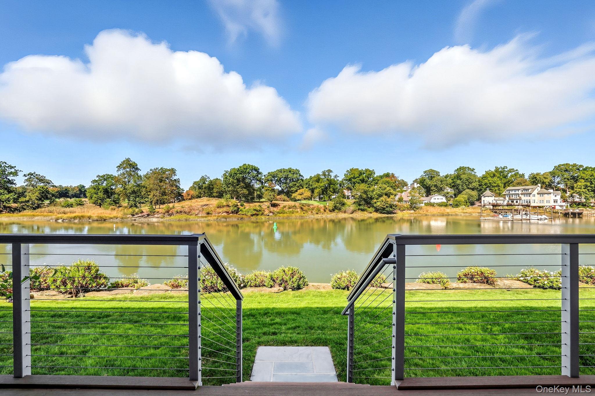 720 Milton Road, Unit H3 Rye, NY 10580 - Photo 1 of 27 a view of a lake with a big yard