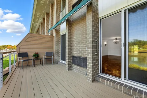 a view of a house with a window and a small yard
