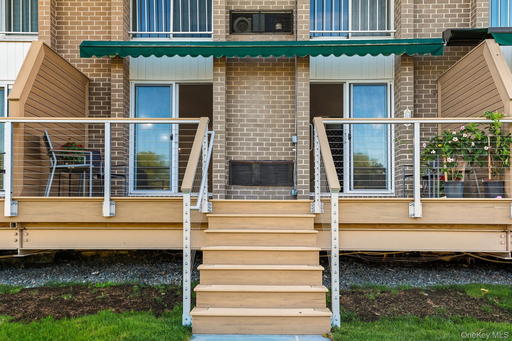 720 Milton Road, Unit H3 Rye, NY 10580 - Photo 17 of 27 a view of a house with a window and a small yard