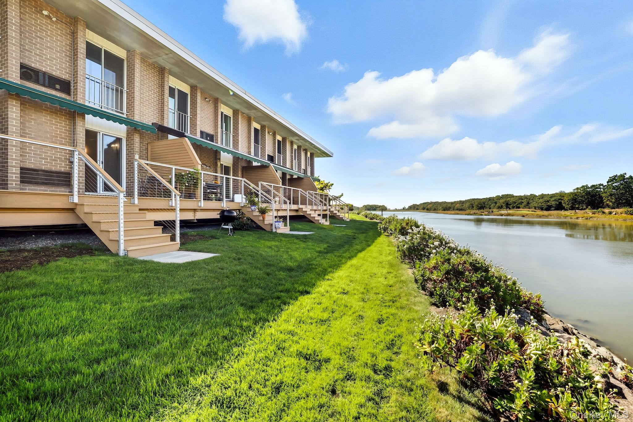 720 Milton Road, Unit H3 Rye, NY 10580 - Photo 18 of 27 a view of a house with a yard and sitting area