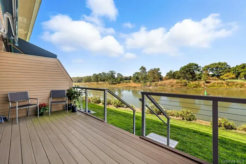 a view of a lake with a yard