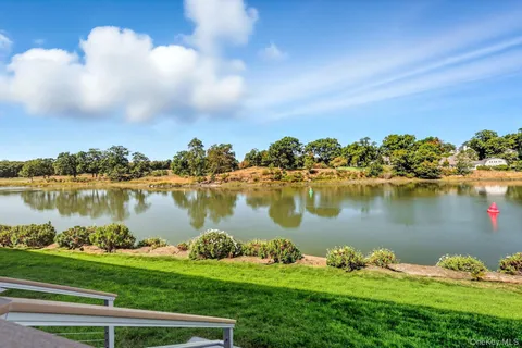 a view of a balcony with lake view and mountain view